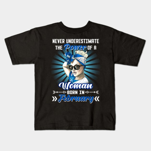 Never Underestimate The Power Of A Woman Born In February Kids T-Shirt by Manonee